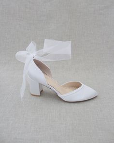 Smooth satin almond toe block heel perfect for all special occasions. Elaborated with matching satin or sheer ribbons that ties to an oversized bow around ankle to add dancerly grace to any ensemble. Perfect style for wedding, bridal shoes, bridesmaids, date-night, or any special occasions.DETAILS:HEEL HEIGHT: 2.75 inchesCOLORS AVAILABLE: Champagne, White, Ivory, Navy, Burgundy, and Light BlueUPPER: Synthetic upper and liningMATERIALS: Manmade outsoleSTYLE NAME: SALLY Low Heel Satin Wedding Heels, Satin Low Heel Wedding Heels, Satin Wedding Shoes With 4-inch Heel, Wedding Heels With Heel Strap In Satin, Satin Heels With Heel Strap For Wedding, Block Heel Ribbon Heels For Evening, Closed Toe Satin Heels For Wedding, Satin Closed Toe Heels For Wedding, Wedding Shoes With Bow And Block Heel