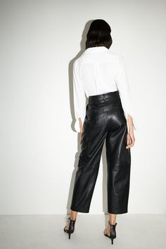 Crafted from real leather for a luxurious look and feel
Barrel leg silhouette creates a modern, relaxed fit
Sleek leather construction exudes an edgy, confident vibe
Zip fly front for a clean, tailored finish
Versatile design suitable for casual and smart-casual occasions
Embrace a bold, fashion-forward aesthetic with these real leather barrel leg trousers. The leather construction radiates a confident, edgy appeal, while the relaxed barrel leg silhouette offers a contemporary twist on classic tailoring. Pair them with a crisp white shirt and heeled sandals for a chic, casual ensemble, or elevate the look with a silk camisole and blazer for smart-casual events. These versatile trousers are a must-have for the modern, fashion-conscious woman seeking a touch of luxury in her wardrobe. Classic Tailoring, Lace Skater Dress, Crisp White Shirt, Silk Camisole, Chic Casual, Shoes With Jeans, Going Out Dresses, Denim Outfit, Jeans For Sale