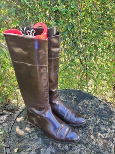 "Vintage Joan and David tall equestrian style brown leather riding boots. Classic and elegant equestrian flat boots for fall and winter! Perfect for long dresses! Size 9.5 Pull on style with pull tabs. *BOOTS HAVE WEAR AND TEAR ON THE INSIDE AND OUTSIDE OF BOTH BOOTS * Length: 10\" Width: 3 1/2\" Heel: 1\" Height: 14\" Top: 14\" Color: Brown Condition: Good Vintage Brand: Joan and David" Brown Wide Calf Knee-high Boots For Riding, Brown Wide Calf Boots For Business, Brown Winter Riding Knee-high Boots, Classic Brown Knee-high Boots For Riding, Classic Brown Knee-high Riding Boots, Brown Round Toe Riding Boots, Brown Knee-high Riding Boots For Fall, Brown Riding Boots For Winter, Winter Riding Boots In Brown