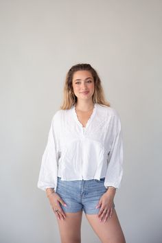 White Summer Embroidered Top Summer Embroidered V-neck Peasant Top, Bohemian V-neck Blouse With Embroidered Hem, Cotton V-neck Blouse With Embroidered Hem, Spring Split Neck Tops, Casual V-neck Blouse With Embroidered Hem, White Henley Neckline Top For Spring, Cotton V-neck Blouse, White Relaxed Fit V-neck Top For Spring, Bohemian Relaxed Fit V-neck Blouse