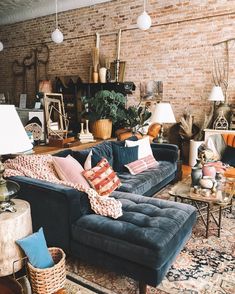 a living room filled with furniture and lots of pillows