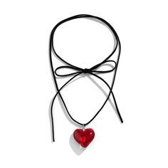 a red heart hanging from a black cord