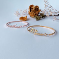 This bangle is handmade according to your names and size,High-quality gold plating, lasting color retention,3 mm width is very dainty,If you order this for baby,we could make it according to the size the baby need,just note the size please. Material： stainless steel, high-quality 18 K gold Plated(High quality Color retention) Size: Bangle width: 3 mm, Name plate size: about 8 mm*35 mm(Adjust according to name length) Custom: 1, Select the color and size you need. 2, Input the name and font you w Engraved Name Bangle Bracelet For Mother's Day, Customizable Gold Bangle For Anniversary, Custom Name Gold Bangle, Elegant Gold Bangle With Custom Name, Mother's Day Engraved Name Bangle Bracelet, Gold Name Bracelet As Gift For Mom, Gold Customizable Name Bracelet As Gift For Mom, Custom Name Bangle For Mother's Day, Personalized Gold Name Bracelet As Gift For Mom