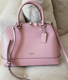 Coach Crossgrain Sierra Satchel Shoulder Handbag PINK Patent Crossgrain Leather Inside cell phone and multifunction pockets Zip closure, fabric lining Handles with 4 1/4" drop Outside slip pocket Detachable strap with 21 1/2" for shoulder or crossbody wear 13 1/2" (L) x 9 1/2" (H) x 4 3/4" (W) Style No. F31352 Like new. No tags. No notable flaws.  Msrp $428. Excellent condition. Gorgeous. Sold out in this color. No dustbag.smoke and pet free home. Guaranteed authentic. No lowball offers plse. Designer Pink Bag With Dust Bag, Designer Pink Bags With Dust Bag, Pink Handheld Bag For On-the-go, Designer Pink Shoulder Bag For On-the-go, Designer Pink Top Handle Bag, Luxury Pink Bag With Double Handle, Classic Pink Shoulder Bag With Removable Pouch, Designer Pink Bags For Travel, Feminine Coach Bags For Everyday Use