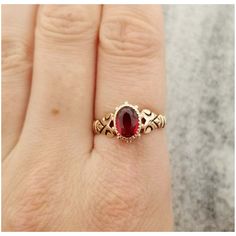 This is an oval garnet gemstone bezel set in a stunning antique rose gold band. The band has a unique shoulder design. The ring is a size US 7 The front of the ring measures  3/8 inch (10.3mm) tall 1/4 inch (8mm) wide It doesn't have a gold mark but acid tests as being made from 10k gold. The ring is in good antique condition. It does show some wear overall and the band appears to have been resized. Please inspect photos closely before purchasing. This item will be shipped fully insured with signature conformation in the United States. Just send me a message if you have any questions. Oval Rose Gold Ruby Ring With Rose Cut Diamonds, Oval 14k Rose Gold Fine Jewelry, Heirloom 14k Rose Gold Oval Jewelry, Heirloom Oval 14k Rose Gold Jewelry, Oval Rose Cut Diamond Jewelry In 14k Rose Gold, Oval Rose Cut Diamonds In 14k Rose Gold Jewelry, Classic Oval Rose Gold Birthstone Ring, Rose Gold Ruby Ring Oval, Vintage 14k Rose Gold Oval Jewelry