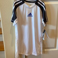 Nwt Adidas Climalite Kids Shirt, White, Dark Gray, Royal Blue Logo, Size L White Adidas Workout T-shirt, Sporty White Breathable T-shirt, White Breathable Sportswear T-shirt, White Team Name Sportswear Activewear, White Sportswear Activewear With Team Name, Adidas White Activewear With Three Stripes, White Short Sleeve Activewear For Sports Events, Adidas Breathable Crew Neck T-shirt, White Adidas Activewear For Sports