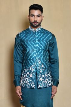 Blue sleeveless mandarin collar bundi in silk base with mystic gladiolus bloom embroidered details. Paired with a full sleeves cross cut hem plain kurta and gold pant. - Aza Fashions Plain Kurta, Gold Pants, Kurta Set For Men, Nehru Jackets, Embroidered Details, Silk Embroidery, Kurta Set, Blue Silk, Full Sleeves