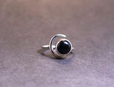 Crafted with care and creativity, this Black Onyx Moon Ring boasts an exquisite sterling silver design that embraces elegance. The round Onyx stone adds a touch of mystique and sophistication to this adjustable stacking ring, making it a perfect promise or gift for her. Handmade with attention to detail, this unique piece of jewelry is a symbol of timeless beauty. The versatility of this handmade ring allows for effortless stacking with other favorites or shining brilliantly on its own. Elevate your style with this stunning Black Onyx Moon Ring that exudes charm and grace in every detail. Sterling Silver Crescent Ring For Anniversary, Silver Crescent Rings Nickel Free, Nickel Free Silver Crescent Rings, Nickel-free Silver Crescent Rings, Nickel Free Sterling Silver Crescent Rings, Silver Crescent Crystal Ring For Gift, Nickel-free Sterling Silver Crescent Rings, Nickel-free Crescent Sterling Silver Rings, Silver Crescent Gemstone Ring