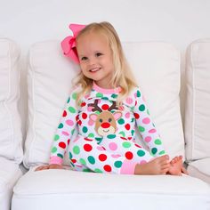 These Reindeer Multi Polka Dot Pink Pajamas will have your little ones all ready for Christmas morning! The pajama top features an adorable Rudolph appliqué on a soft polka dot print with pink ribbing, making them perfect for the coziest holiday of the year. The set includes matching polka dot pajama bottoms. Add a monogram to personalize your Christmas look! Designed to be snug-fitting. Please check the Size Chart for measurements and order accordingly.