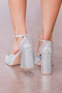 Details Silver Sparkle Chunky Heel Buckle closure Heel height: 4" Material and Care Made of man made materials Materials may have natural variations Colors may vary from different viewing devices. If you are returning a pair of shoes: Shoe boxes must be encased in another box for shipping to protect the items. If you send shoes back with stickers and return labels directly on the box, or if the shoe box is damaged, then we will not accept a return. Single Diamond Ring, Gold Knot Earrings, Cocktail Dress Wedding Guest, Return Labels, Sparkle Heels, Prom 2024, Closed Toe Heels, Shoe Boxes, Pink Rompers