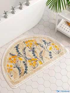 a bathroom rug with yellow flowers on it