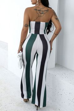 Show off your sexy curves with our bodycon jumpsuit printed with vertical colorful stripes, and crafted from high-quality polyester with ultra stretchiness that hugs your body nicely. This jumpsuit is featuring a sleeveless bandeau top with a slip-in fit, cutout details, a wrap belt with a front tie, a skinny fit, and cute-looking flare legs. Details: Women Jumpsuit Colorful Cutout Bandeau Bodycon Belt Backless Sleeveless Tie Skinny Flare Slip-In Stretchy Chic Fitted Jumpsuits And Rompers With Vertical Stripes, Trendy Striped Fitted Jumpsuits And Rompers, Trendy Fitted Striped Jumpsuits And Rompers, Fitted Jumpsuits And Rompers With Vertical Stripes, Fitted Striped Sleeveless Jumpsuits And Rompers, Bandeau Jumpsuit, Casual Elegant Style, Tube Jumpsuit, Party Rompers