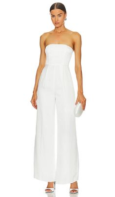 Find LOVERS AND FRIENDS Cambri Jumpsuit In Ivory on Editorialist. Lovers and Friends Cambri Jumpsuit in Ivory. - size M (also in S, XL, XS) Lovers and Friends Cambri Jumpsuit in Ivory. - size M (also in S, XL, XS) 100% polyester. Made in China. Dry clean only. Hidden back zipper closure. Boned bodice. Stone washed satin fabric with subtle pleated detail. Neckline to hem measures approx 52 in length 24 at the knee and 24 at the leg opening. LOVF-WC322. ACJS395 F23. Constantly inspired by the laid Elegant Fitted Strapless Jumpsuit For Wedding, White Strapless Jumpsuit For Evening, White Sleeveless Jumpsuits And Rompers For Formal, White Sleeveless Jumpsuits And Rompers For Formal Occasions, White Sleeveless Jumpsuit For Formal Occasions, White Fitted Jumpsuits And Rompers For Formal Occasions, White Fitted Jumpsuit For Formal Occasions, White Fitted Formal Jumpsuits And Rompers, Elegant White Strapless Jumpsuit For Party