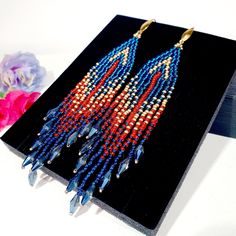 "Seed Bead Earrings 4 inch long.Flowing beads earrings.Bohemian dangle beaded earrings. with fringe are made of high quality Czech and Japanese seed beads. long earrings.Bead weaving techniques. Colors: Sea blue, Matt Gold and Berry red color. ! Details ! Made with quality Japanese and Czech seed beads. Czech crystals. ! Professional threads for weaving with beads Tytan and Fireline. ! Length 4 inches ( 11cm) ! Gold tone metal ear wire. Simple sterling silver ear wire 925 are included with each Bohemian Beaded Crystal Earrings, Bohemian Crystal Earrings With Faceted Beads, Bohemian Beaded Crystal Earrings With Round Beads, Bohemian Beaded Round Crystal Earrings, Red Bohemian Chandelier Earrings With Tassels, Bohemian Dangle Crystal Earrings With Colorful Beads, Bohemian Crystal Dangle Earrings With Colorful Beads, Long Seed Bead Earrings, Earrings With Crystals