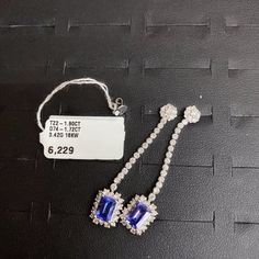 LAST CALL, LAST CHANCE!!! LIQUIDATION SALE!!!The Following Item we are offering is a Rare Important Radiant 18KT Gold Large Rare Fancy Gorgeous Fancy Emerald Cut Glittering Tanzanites and Diamond Dangle Earrings. Earrings are comprised of Beautiful Glittering Tanzanites and Round Dangling Diamonds set in 18KT White Gold!!! T.C.W. approx 4CTS!!! These Gorgeous Earrings are a Rare Sample Pair New With Tags from a Private Manufacturer that sold to Important 5 Star Hotel and Fine Jewelry Stores. Ori Luxury Tanzanite Earrings, Luxury Gia Certified Jewelry For Evening, Luxury Tanzanite Jewelry For Evening, Luxury Tanzanite Drop Earrings, Elegant Tanzanite Dangle Earrings, Elegant Tanzanite Formal Earrings, Elegant Tanzanite Earrings For Formal Occasions, Luxury Tanzanite White Gold Earrings, Luxury White Gold Tanzanite Earrings