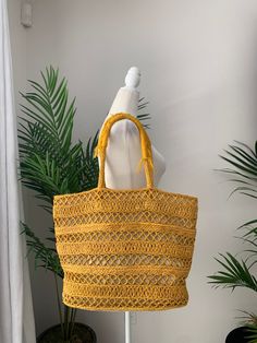 Sunflower yellow, bohemian, woven raffia, tote bag with yarn handles. Bag is lined in a neutral fabric, has one open pocket, and is flat on the bottom. In used condition, with a tear in the lining as well as staining, (see pictures for details). Portal Design, made in India. Dimensions Height 13in/33cm Across 14.5in/37cm Handle 22in/56cm *Please keep in mind that unless otherwise noted, all items in my shop are used or previously owned, normal wear and tear is expected, flaws that are noted are Portal Design, Raffia Tote Bag, Neutral Fabric, Sunflower Yellow, Straw Tote Bag, Woven Raffia, Straw Tote, Little Miss, Vintage 70s