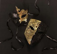 Black and gold Masquerade couples mask set are made of a lightweight laser cut metal that has a unique pattern. Masks are hand painted in two tone half gold and half black.   Masks are durable and have a comfortable fit. Silk ribbon ties attached. These masks are great for any Masquerade style event. Black And Gold Masquerade Mask, Masquerade Mask Black, Couples Masquerade Masks, Gold Masquerade Mask, Masquerade Prom, Luxury Mask, Mens Masquerade Mask, Masquerade Wedding, Venetian Masquerade Masks