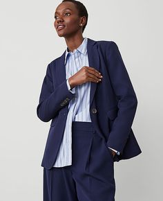 Elevate your wardrobe with the Ann Taylor Long One Button Notched Blazer, a symbol of sophistication and effortless style. This navy blazer is designed to flatter with its tailored fit and elegant single-button front.

- **Size**: 12 Regular
- **Color**: Navy
- **Gender**: Female
- **Material**: 73% Polyester, 24% Rayon, 3% Spandex; Lining: 100% Polyester
- **Features**: Notched lapel, long sleeves with button-open option, front flap besom pockets, back vent, fully lined
- **Length**: 27 inches Tailored Button-up Blazer For Career, Tailored Blazer With Button Cuffs For Business Casual, Office Wear Button-up Blazer With Button Cuffs, Button-up Blazer With Button Cuffs For Office, Business Casual Button-up Blazer With Button Cuffs, Professional Office Wear Blazer With Button Closure, Office Wear Blazer With Button Cuffs, Business Casual Blazer With Button Cuffs, Tailored Workwear Blazer With Button Cuffs