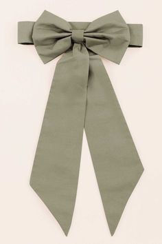 a green bow tie on a white background