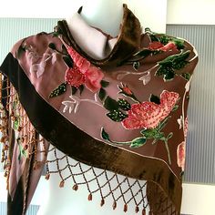 Absolutely stunning shawl designed in Art Deco style by Rabella. Flamboyant and highly decorative it is made with a burnout velvet technique with a 100% silk base. The shawl is embroidered and beaded (feels pretty heavy) with jeweled ends. The shawl is brown featuring various pink shades of gorgeous roses. It measures 34x66 inches. You can use it as a unique piece of accessory or even a home decor to create a special atmosphere of vintage elegance. The shawl will definitely make a luxury gift. I Wedding Shawl Scarf With Motifs, Wedding Shawl With Motifs, Wedding Shawl With Intricate Embroidery, Elegant Wedding Scarves With Motifs, Bohemian Brown Dupatta For Wedding, Bohemian Wedding Scarves With Traditional Drape, Bohemian Wedding Shawl With Motifs, Bohemian Wedding Scarves With Intricate Embroidery, Vintage Shawl With Traditional Drape For Wedding