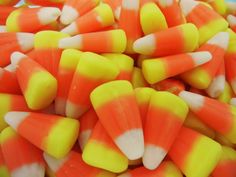 there are many orange and yellow candy canes