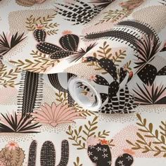 an image of a wallpaper with cactus and leaves on it's surface,