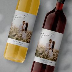 two bottles of wine sitting next to each other