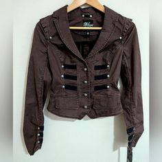 Nwt Blanc Noir Cropped Military Style Twill Jacket Brown Black Small Runs Snug Blanc Noir Sold At Nordstrom Military Style Retro Style With Free People Vibes Cropped Fabric Tag Missing, But 100% Cotton Twill With Ribbon Detail Steampunk Pit To Pit Flat Across 15" Shoulder To Hem 18" Would Fit Xs Brown Fitted Outerwear With Snap Buttons, Fitted Brown Outerwear With Snap Buttons, Fitted Brown Cropped Jacket For Work, Steampunk Outerwear With Button Closure For Fall, Brown Steampunk Outerwear For Winter, Brown Steampunk Winter Outerwear, Steampunk Brown Winter Outerwear, Fitted Brown Blazer With Snap Buttons, Xmas List