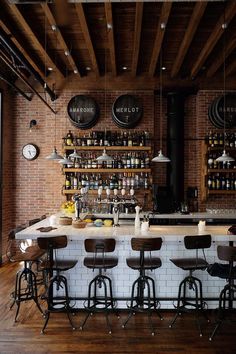 an instagramted photo of a bar with stools