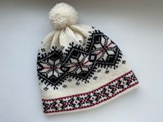 This winter hat with Norwegian pattern is extra warm, protecting a head in cold and windy weather. This winter hat has a wool inner making it comfortable to wear. This hat can be a perfect gift for Christmas. The hat is made of 100% natural wool from sheep, which assures natural and environmental friendliness. All wool items in my shop are washed - Ready to wear! Material: 100% wool Colours: -White/Black Sizes: *Head circumference: 54-56cm (21.26-22.05in) Hat height: 23cm (9.06in) *57-59cm (22.4 Winter Bonnet For Cold Weather, Warm Winter Cap, Winter Brimmed Beanie For Cold Weather, Brimmed Winter Beanie For Cold Weather, Brimmed Beanie For Winter, Warm Cream Beanie For Winter, Knitted Winter Bonnet Cap, Hand Knitted Brimmed Bonnet For Winter, Winter Sports Knitted Beanie