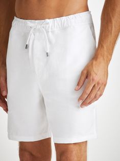 Our Sydney shorts in white are cut for a regular fit for the perfect, warm weather ready style. We have developed a mid-weight, beautifully soft and breathable pure linen that will keep you cool and comfortable in even the hottest of conditions. This made in Italy fabric is finished by being piece-dyed before construction for a bright and vibrant pure white. The Sydney short features a curved back yoke for a great fit and an elasticated waistband with drawcord for comfort. The front of the short White Bermuda Shorts With Built-in Shorts For Vacation, White Bermuda Shorts With Pockets For Summer, White Relaxed Fit Bermuda Shorts For Summer, Casual White Bermuda Shorts For Vacation, White Bermuda Shorts For Summer Vacation, Relaxed Fit Linen Beachwear Bottoms, Relaxed Linen Bottoms For Beachwear, White Relaxed Fit Bermuda Shorts, White Cotton Bermuda Shorts For Summer