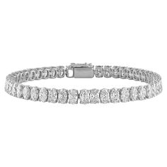 17.01ctw Oval Tennis Bracelet, a timeless symbol of elegance and grace. Crafted with precision and finesse, this exquisite bracelet features 41 dazzling oval diamonds, each measuring 5.5x4.1mm. Set in luxurious 18kt white gold, these diamonds boast a total weight of 17.01 carats and exhibit stunning white color and VS clarity. With a classic 7-inch length, this tennis bracelet exudes sophistication and charm, making it the perfect accessory for any occasion. Indulge in the unmatched beauty and b Luxury Oval Tennis Bracelet Fine Jewelry, Luxury White Gold Oval Bracelets, Luxury Oval Diamond White Bracelet, Luxury Timeless Oval Diamond Bracelet, Luxury White Gold Oval Diamond Bracelet, White Gold Oval Tennis Bracelet With Prong Setting, Oval White Gold Tennis Bracelet With Prong Setting, Oval Diamond Bracelet With 17 Jewels, White Gold Diamond Tennis Bracelet With Oval Links