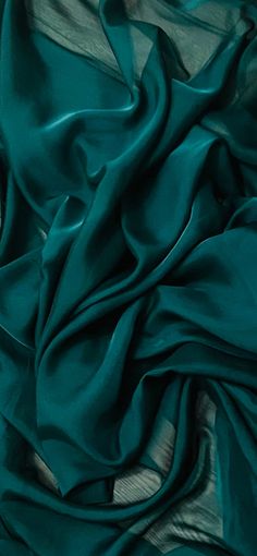 the fabric is very dark green and it looks like silk