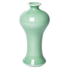 a light green vase sitting on top of a white table