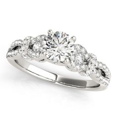 a white gold engagement ring with diamonds on it