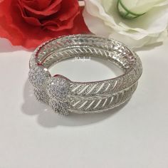 Indian bollywood fashion American Diamond 2pcs bridal wedding 22K silver plated bangles set These are high quality silver plated bangles set. Have done silver plating on it for a brilient shine. These looks great when you worn alone or in pair. They are sure to make your hands look beautiful. A popular combo to wear with many outfits. A perfect gift for your loved ones or yourself.  A perfect ornament for wedding, parties or any special event.  Main Colour: Silver Stone Colour: Clear White  Prod Bollywood Style Silver Bangle Bracelet, Silver Festive Bangle For Anniversary, Silver Bridal Bangle Sets For Festive Occasions, Silver Bangle For Anniversary And Festive Occasions, Festive Silver Bangle For Anniversary, Festive Silver Cubic Zirconia Bridal Sets, Silver Bollywood Bangle For Party, Silver Bollywood Bangle As Gift, Hand Set Silver Bangle Bollywood Style