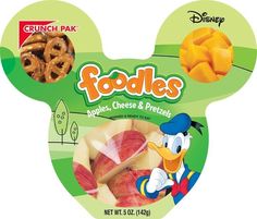 a package of food that includes apples, cheese and pretzels in the shape of mickey mouse