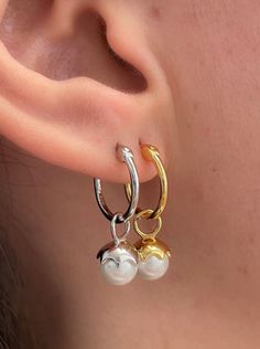 Elegant and classic yet so of-the-moment and wearable, these pearl drop hoops are our new favorite go to look! Available in both silver and gold, these petite hoops pair perfectly with any ear stack or as an elegant every day earring by itself to add a bit of trendy sophistication any look. SIZE & MATERIAL: 16kt gold plated sterling silver, natural freshwater pearls, nickel free Simple Jewellery Designs, Ear Stack, Timeless Jewelry, Simple Jewelry, Silver Pearls, Pearl Drop, Silver And Gold, Gold Plated Sterling Silver, Freshwater Pearls