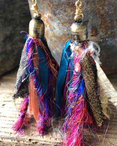 "I had fun making these groovy hippie tassel earrings!  They are perfect summertime earrings that will look so cool with your twisted messy bun or sleek ponytail. Made from colorful recycled sari silk ribbon & yarns and capped in antiqued brass.  Each pair is unique.  Just for fun! Just for the summer! Grab a pair before they are gone and go pick some wild flowers!!  NOTE: The tassel earrings pictured on model are not the pair for sale in this listing. . Approximately 3.5\" total length . ------ Handmade Unique Tassel Earrings For Festivals, Handmade Tassel Earrings For Festivals, Handmade Bohemian Tassel Earrings For Festivals, Multicolor Tassel Earrings For Festival, Multicolor Latkans Tassel Earrings For Summer, Multicolor Tassel Earrings With Latkans For Summer, Colorful Bohemian Fringe Earrings, Traditional Multicolor Tassel Earrings, Bohemian Tassel Earrings For Party