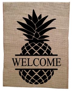 a welcome sign with a pineapple on it