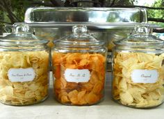 three glass jars filled with different types of chips