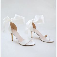 Never Worn Beautiful Ivory Heel. Satin Bow Ties Around Ankle. Company Wouldn’t Return Because It Was Past Return Date. White Open Heel Heels With Bow, White Heels With Bow And Open Heel, Cream Open Toe Heels With Bow, Feminine Cream Ankle Strap Wedding Shoes, White Low Heel Feminine Shoes, Elegant Cream Heels With Bow, White Feminine Heels With Padded Heel, Feminine White Heels With Padded Heel, Feminine White Ankle Strap Heels