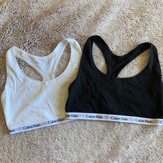 White Never Worn, Black Worn Handful Times. Excellent Condition Both. Size Medium Calvin Klein Black Activewear For Sports, Calvin Klein Black Activewear For Workout, Calvin Klein Black Workout Activewear, Calvin Klein Fitted Sports Bra For Athleisure, Calvin Klein Fitted Athleisure Sports Bra, Fitted Calvin Klein Athleisure Tops, Calvin Klein Sporty Stretch Top, Calvin Klein Fitted Sports Bra, Calvin Klein Athleisure Tops For Sports