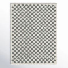 a gray and white rug with squares on it