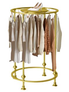 an ironing rack with clothes and shoes hanging from it's sides, on white background