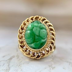 Beatiful handmade carved Jade ring made from 14K yellow gold. Very nice openwork gallery and shoulders, a true vintage piece. In excellent condition. Size 6.75 and sizable upon request for an additional charge. We are a brick and mortar store located in Alhambra, CA. All of our items are guaranteed as described.   SPECIFICATIONS: Size: 6.75 Measurements: 19.7mm x 17mm Jade: 12.5mm x 8mm Total Weight: 6.4 grams   This ring has been inspected by professionals with over 35 years of experience to ensure its excellent condition. **Please inquire about sizing before purchase or making an offer. Order will ship within 24 hours. We offer a 14-day, no-questions-asked return policy.  Please see detailed pictures, as they are part of the description, and do not hesitate to contact us should you have Vintage Carved Yellow Gold Rings, Vintage Green Emerald Ring With Filigree, Green Vintage Oval Filigree Ring, Vintage Green Oval Filigree Ring, Vintage Oval Carved Filigree Ring, Vintage Green Carved Ring, Vintage Carved Green Ring, Carved Jade, Jade Ring