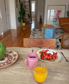 the breakfast is ready to be eaten on the table in the living room and kitchen