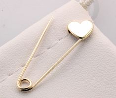 14k Yellow Gold Safety Pin Heart Shape Brooch Handmade in USA Yellow gold safety pin made of solid 14K gold 1.25'' long The jewelry we make is made with recycled and re-refined environmentally responsible precious metals. Please note these pins are not mass produced or cast , each and every one is handmade in our shop with care and great attention to detail. 14K Solid Gold Pin's are made in USA and are of the highest quality. They are nicely polished and stamped for authenticity. Gold Safety Pin Lapel Pin Gift, Gold Safety Pin Lapel Pin For Gift, Gold Safety Pin Shaped Brooch, Gold Safety Pin Shaped Brooch Jewelry, Gold Safety Pin Jewelry For Wedding, Gold Safety Pin Lapel Brooch, Heart-shaped Gold Pins For Gifts, Valentine's Day Gold Jewelry Brooch, Valentine's Day Gold Brooch Jewelry