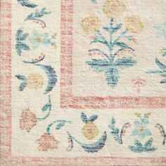 an old rug with flowers and leaves on it