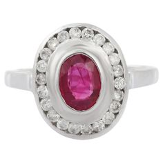 Oval Cut Ruby Cocktail ring in 18K Gold which perfectly goes with your personality and also helps you to improve your energy and sensuality. Designed with oval cut ruby in center and halo of diamonds that makes it a perfect fit to wear it on your wedding or style it with any of your basic outfit to give it a glam. This is a perfect July Birthstone Jewelry also perfect Handmade Jewelry, Bridal Shower Gift, Valentine Gift, Gift For Sister, Mother Daughter Gift, Bride To Be Gift, Bridesmaid Gift, M Ruby Cocktail, Bff Gift, Mother Daughter Gifts, Gift Best Friend, July Birthstone Jewelry, Gold Gemstone Ring, Gift Valentine, Diamond Cocktail Rings, Jewelry Bridal